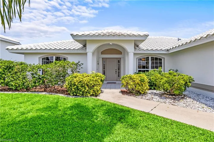 Mediterranean / spanish-style home with a front lawn