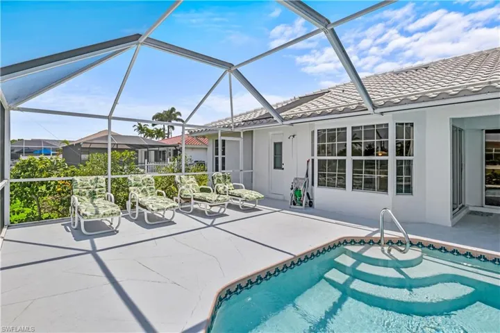 View of pool featuring a patio and a lanai