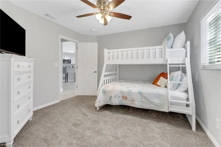 Bedroom featuring carpet flooring and ceiling fan