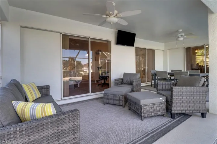 View of patio / terrace with an outdoor living space and ceiling fan