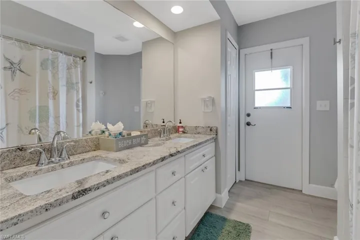 Bathroom featuring vanity and hardwood / wood-style flooring
