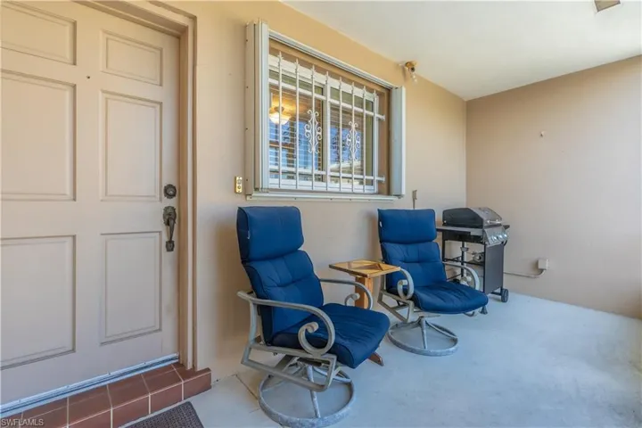 Doorway to property with stucco siding