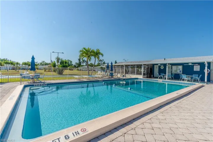 Pool featuring fence and a patio