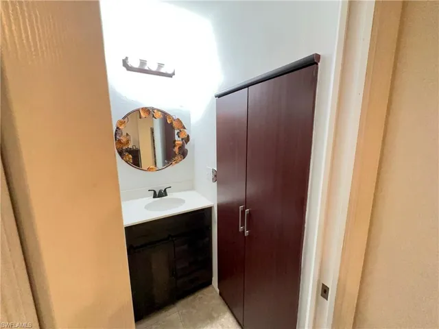 Bathroom with vanity and tile patterned floors