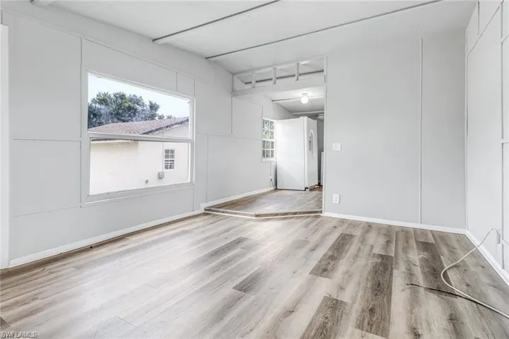 Unfurnished room with light wood-type flooring