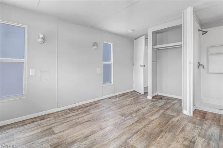 Unfurnished bedroom with light hardwood / wood-style flooring