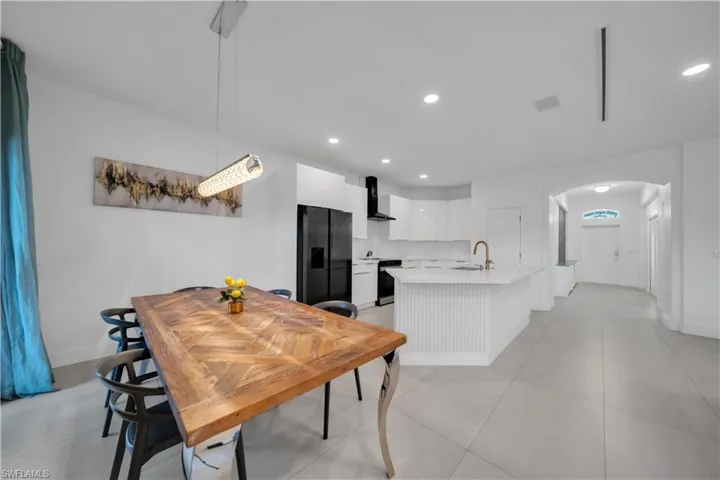 Dining area with recessed lighting and baseboards