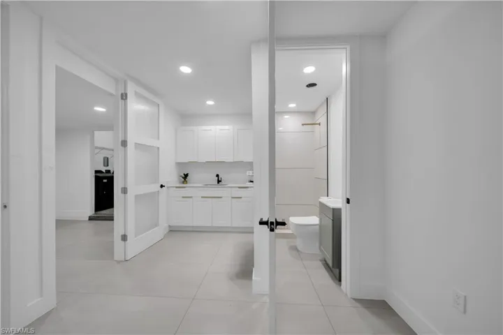 Bathroom featuring vanity, recessed lighting, and a shower