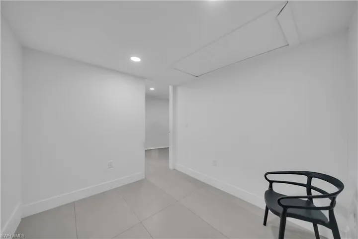 Below grade area featuring baseboards and recessed lighting