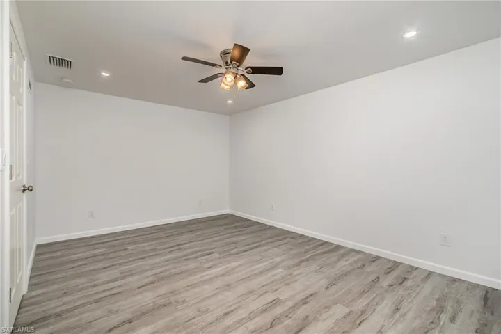 Unfurnished room with recessed lighting, ceiling fan, and light wood-style floors