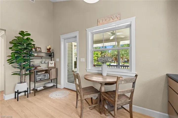 Dining area featuring light wood-style floors and a ceiling fan