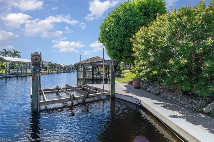 Dock with a water view and boat lift