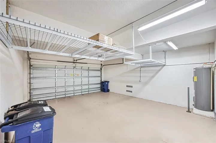 Garage featuring electric water heater