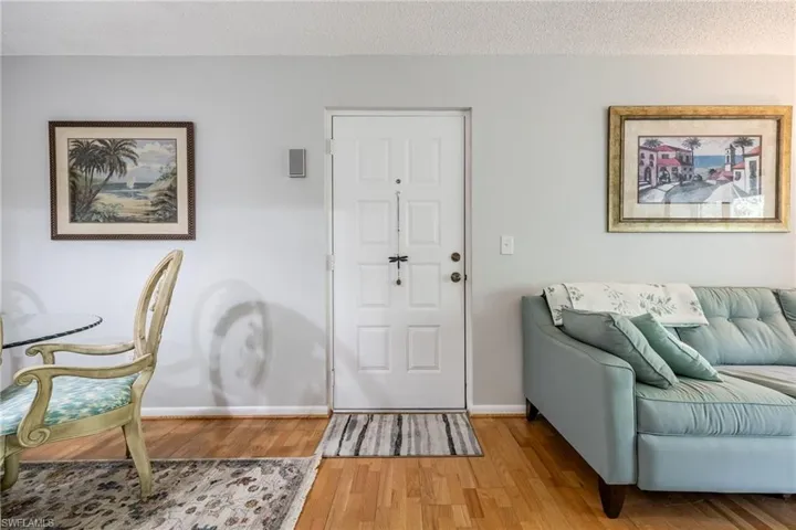 Foyer featuring hardwood / wood-style floors and a textured ceiling