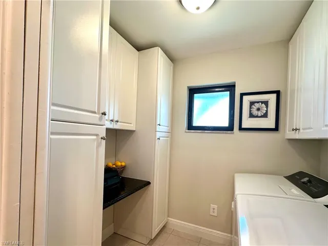 The utility room has ample custom cabinets/storage on all the walls, plus new washer and dryer, a built-in computer desk and a pantry. The closet organizer system maximizes the space