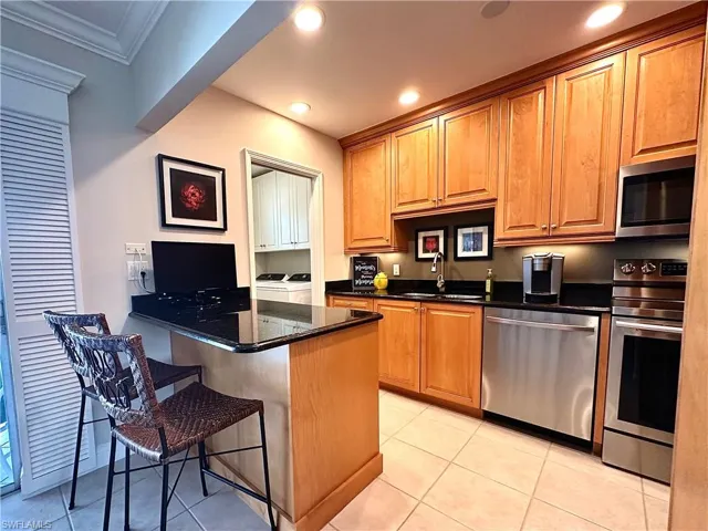 A kitchen Island and newer stainless-steel appliances. This home has been lightly lived in and meticulously maintained. It shows!