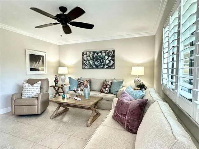 Open living room space with plantation shutters. All the popcorn ceilings were replaced with textured ceilings.The light fixtures and fans have all been upgraded