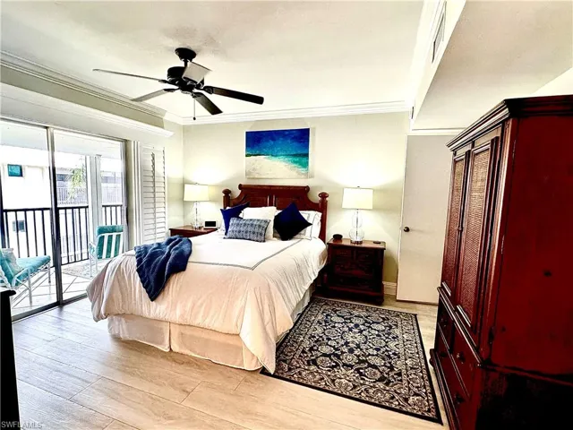 The enlarged master bedroom has an additional free-standing armoire closet. The sliders add lots of light and access the lanai. Pretty 9" X 5" vinyl plank flooring adds to the soft coastal colors of each room