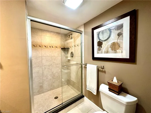 The Guest bath has been tastefully remodeled: Frameless shower doors, newly tiled shower areas, and beautiful wood vanities with granite tops