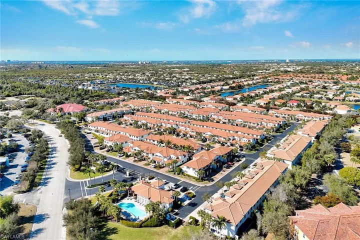 Aerial view of property's location with nearby suburban area