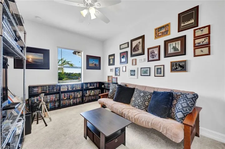 Bedroom with light colored ceiling fan