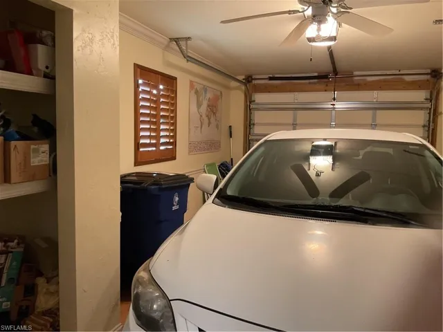 Garage featuring a garage door opener