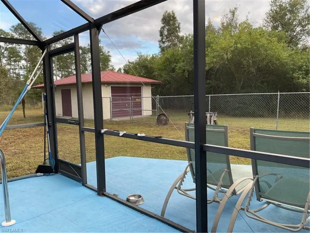 Unfurnished sunroom with healthy amount of natural light