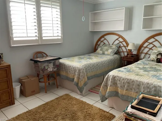 Bedroom featuring light tile patterned flooring