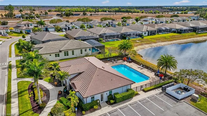 Aerial perspective of suburban area with a pool