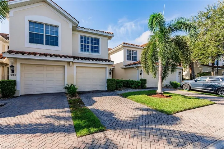 Mediterranean / spanish-style home with a garage