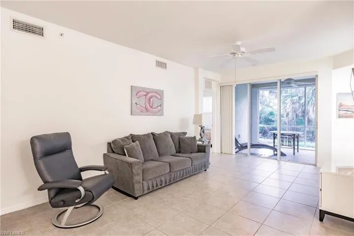 Tiled living room with ceiling fan