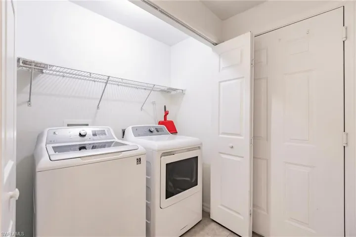Laundry room with washing machine and dryer