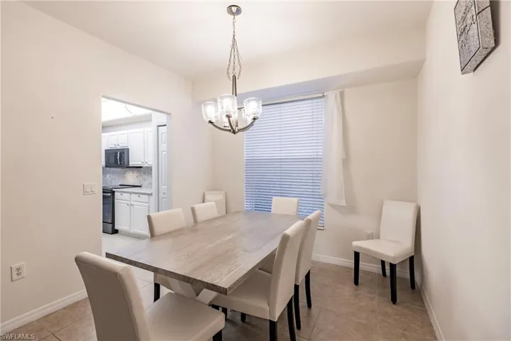 Dining room featuring an inviting chandelier and light tile patterned floors