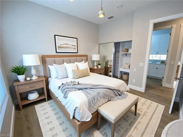 Bedroom featuring wood finished floors and a closet
