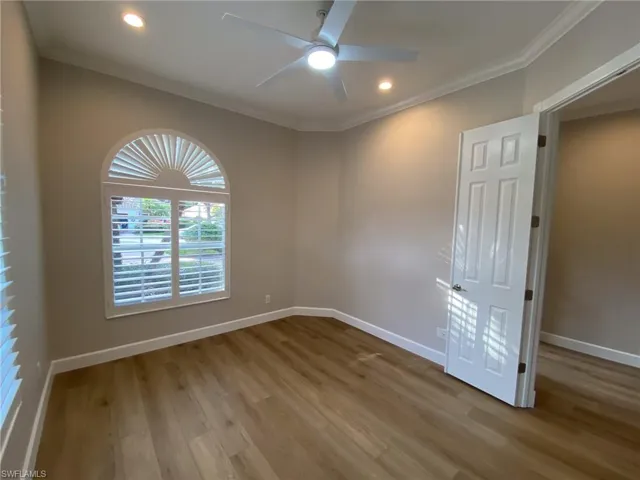Spare room featuring ceiling fan, light wood-type flooring, crown molding, and recessed lighting