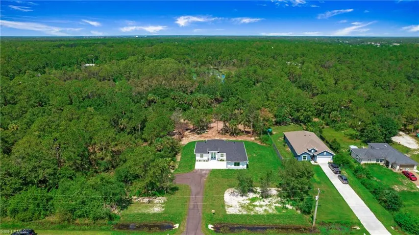 Aerial overview of property's location with a forest