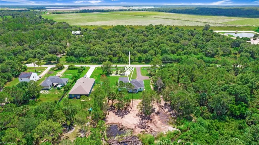 Aerial overview of property's location featuring a heavily wooded area