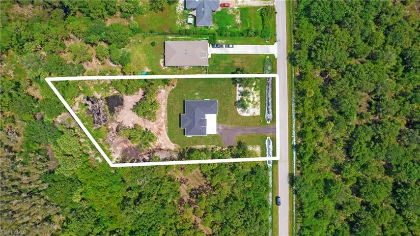 Aerial view of property's location featuring property parcel outlined