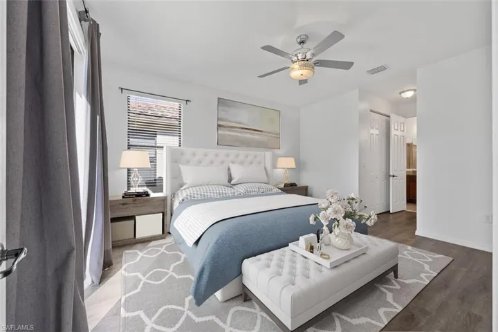 Virtually Staged-Bedroom with visible vents, baseboards, wood finished floors, a closet, and a ceiling fan