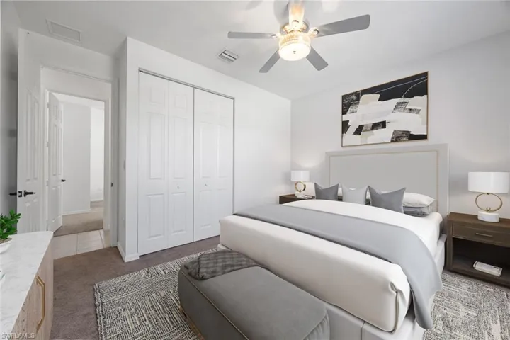 Virtually Staged-Bedroom with a closet, carpet, visible vents, and a ceiling fan