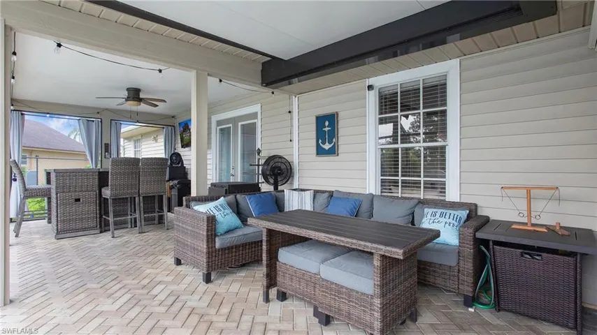 View of patio featuring ceiling fan and an outdoor hangout area