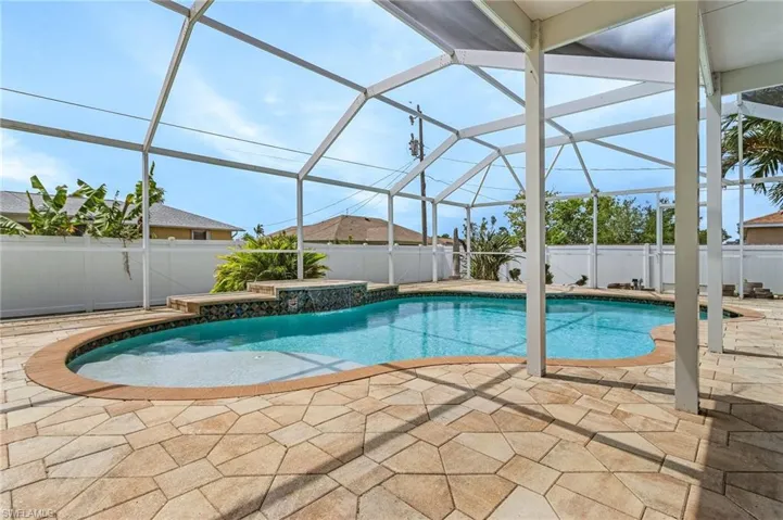 View of pool featuring a fenced in pool, a lanai, a fenced backyard, and a patio