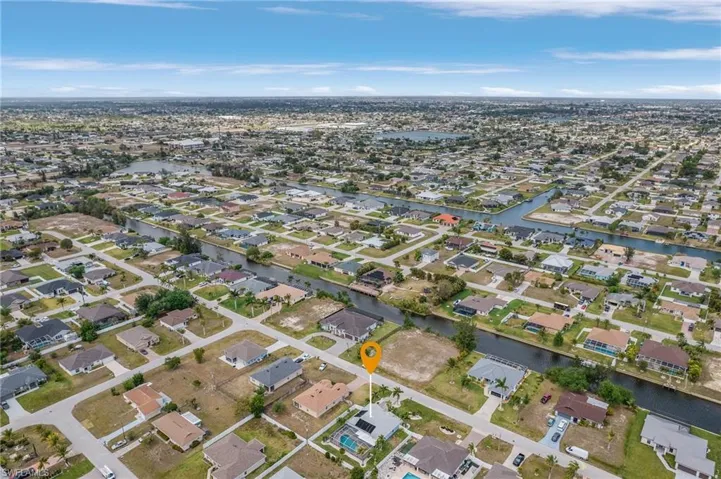 Birds eye view of property featuring a residential view and a water view