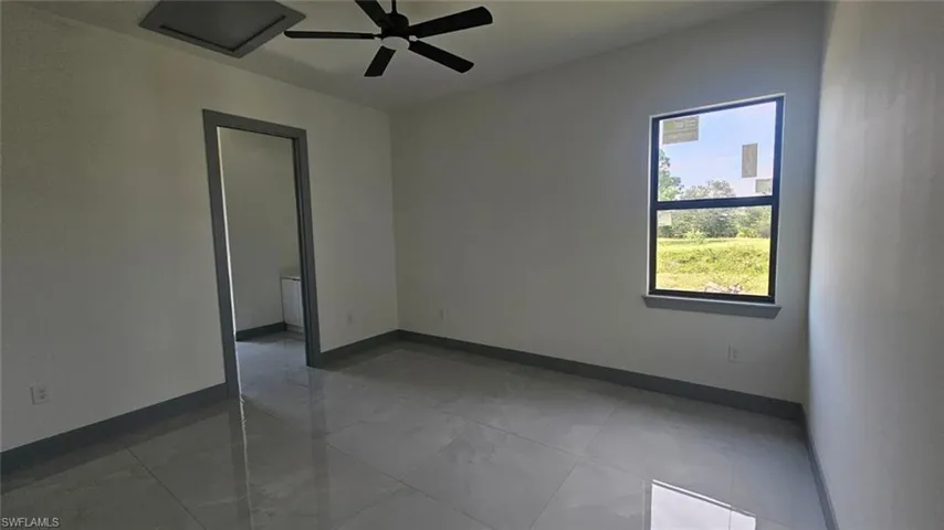 Spare room featuring ceiling fan