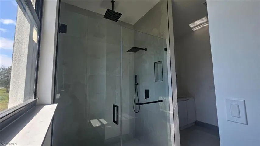Bathroom featuring an enclosed shower