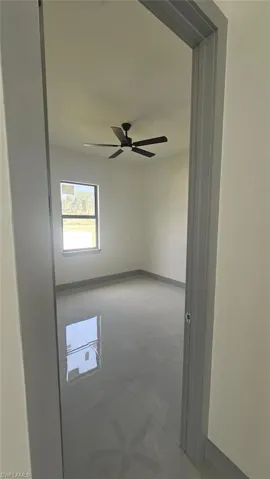 Spare room featuring ceiling fan