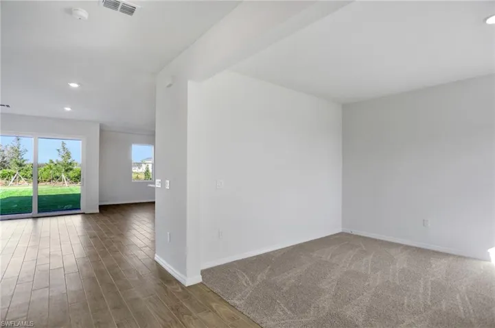 Empty room featuring recessed lighting and light wood-style floors