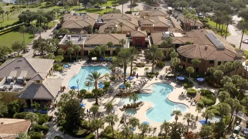Aerial view of property and surrounding area with a pool area