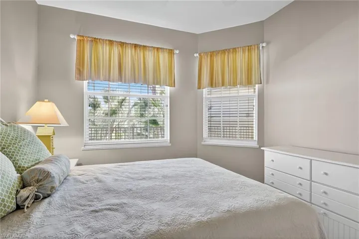 Bedroom featuring multiple windows