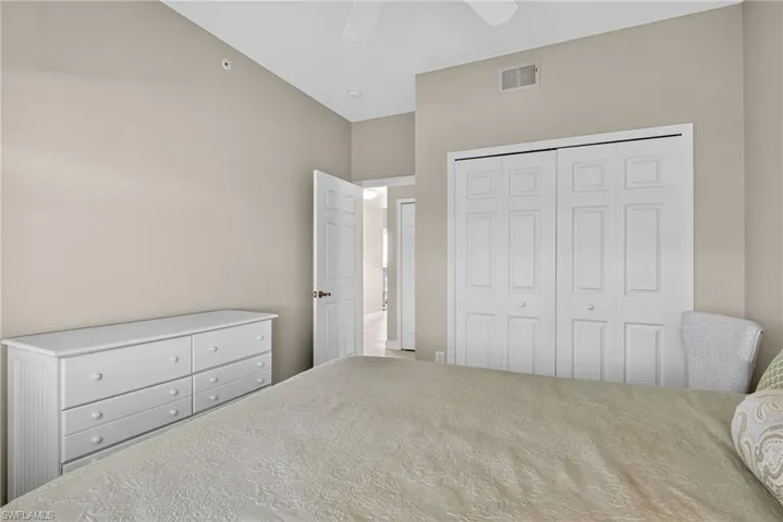Bedroom with a closet and a ceiling fan